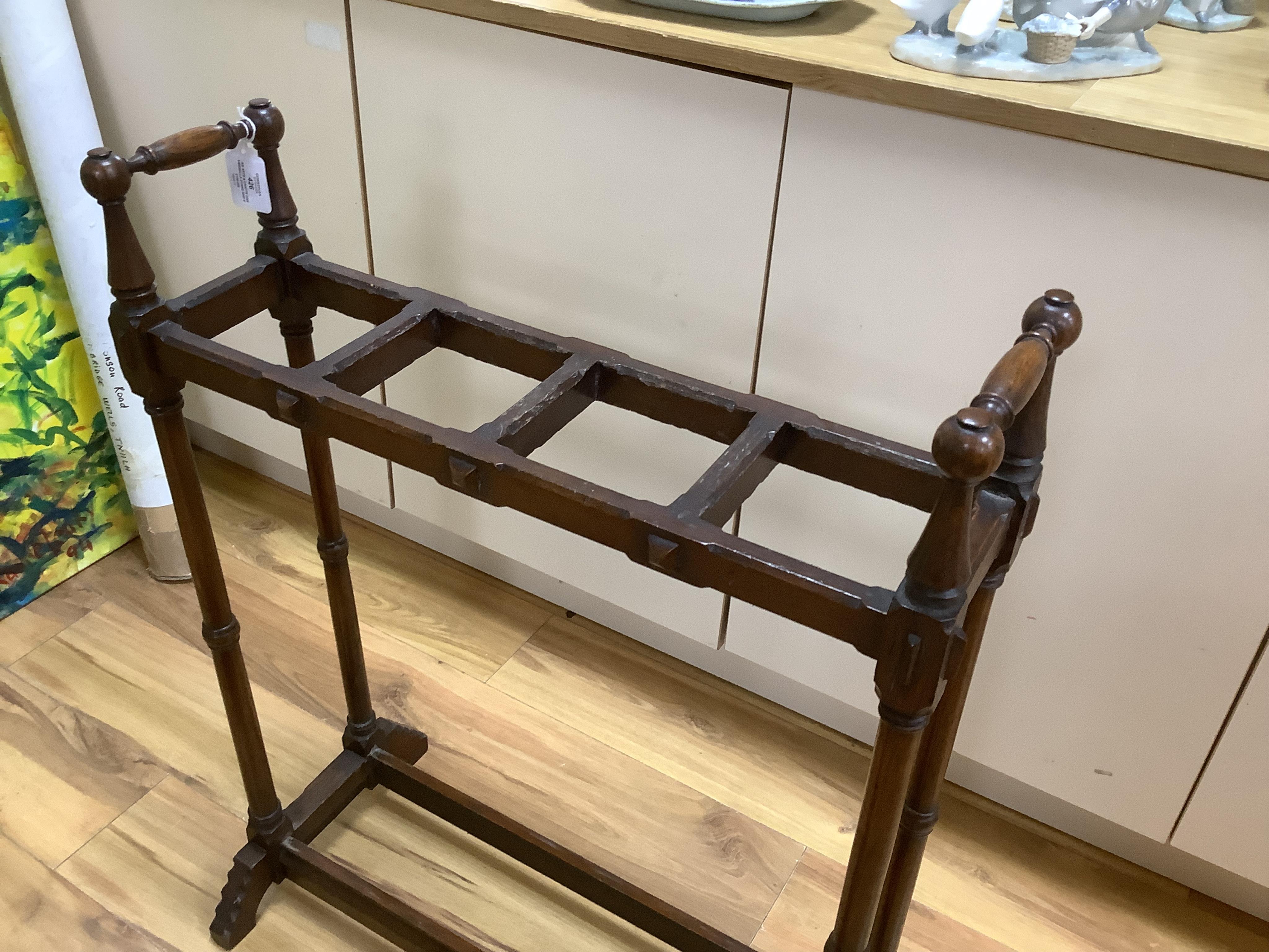 An Arts & Crafts oak umbrella stand and various walking sticks including two silver mounted. Condition - varies